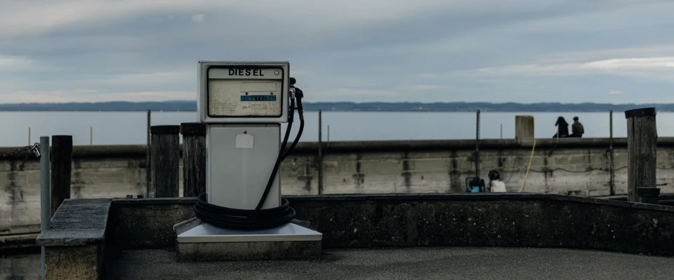 Marine fuel pump at a waterside dock, illustrating boat refuelling and fuel tracking.