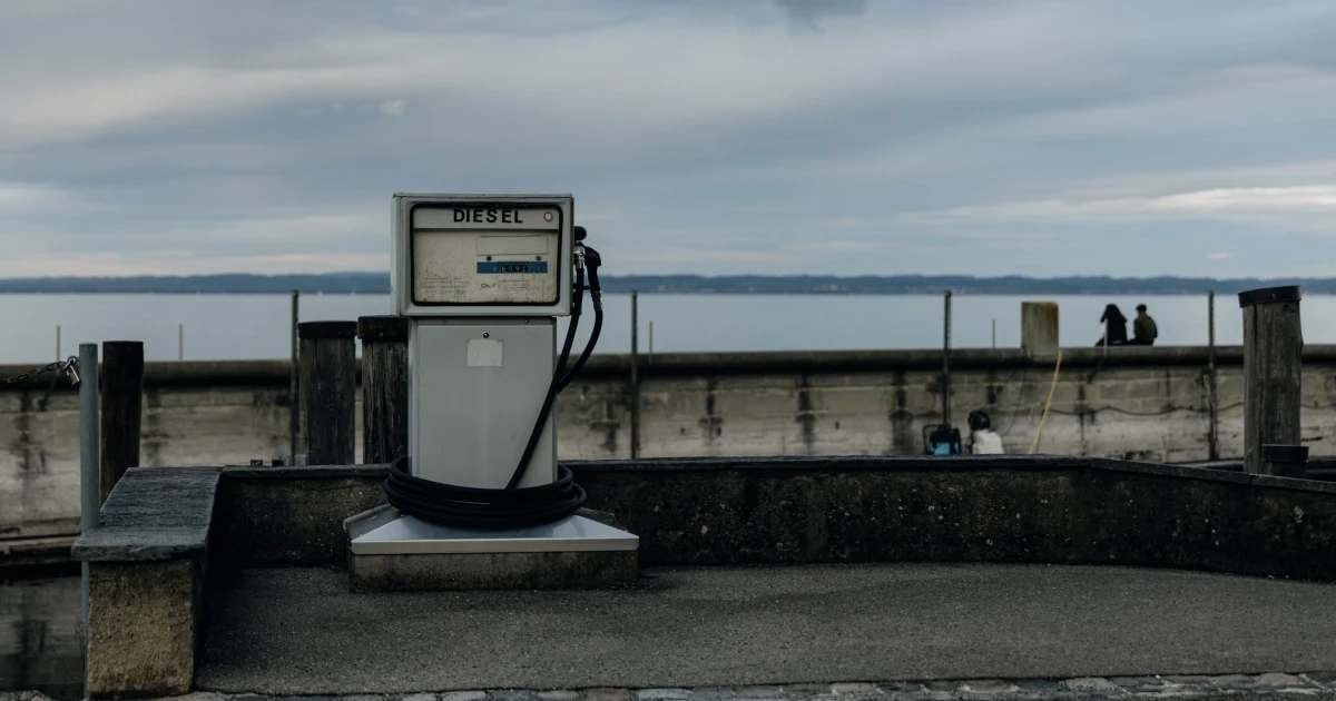 Marine fuel pump at a waterside dock, illustrating boat refuelling and fuel tracking.