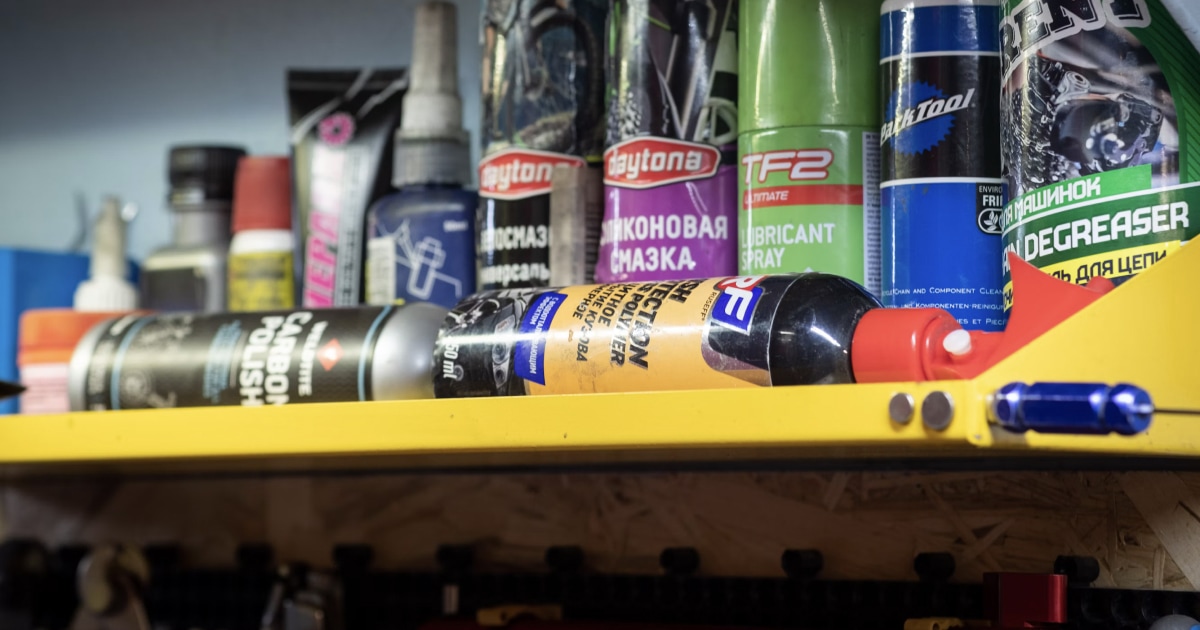 Marine maintenance products and consumables arranged together, including bottles, sprays, and lubricants.