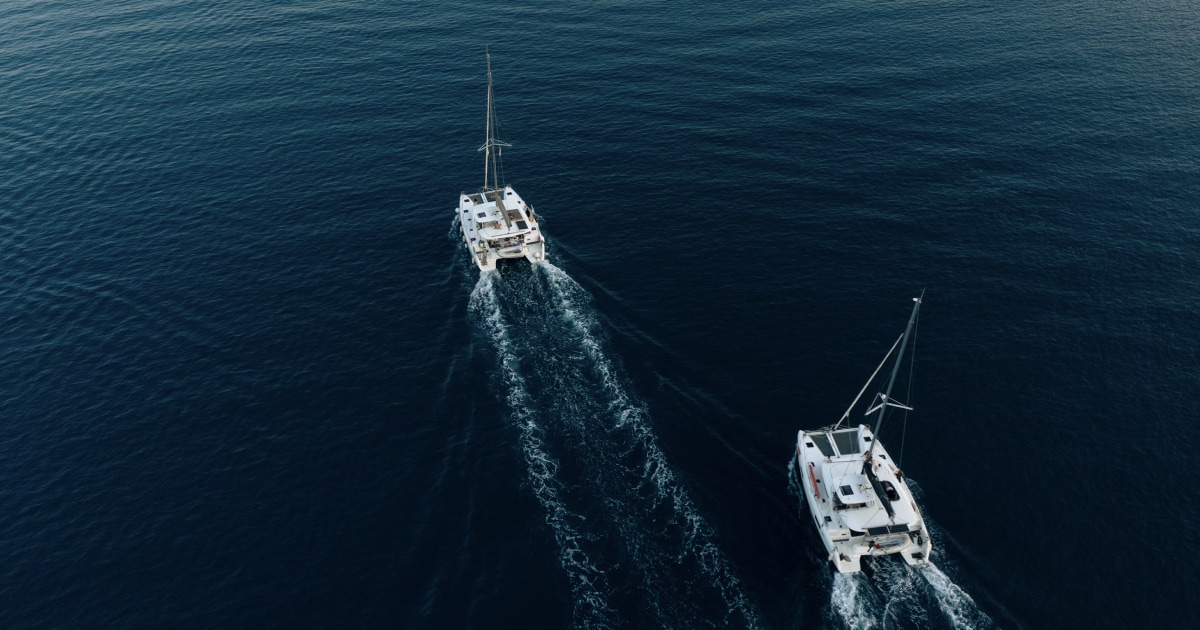 Two boats travelling across open water, viewed from above, illustrating vessel traffic and collision avoidance.